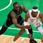 BOSTON, MASSACHUSETTS - MARCH 12: Jaylen Brown #7 of the Boston Celtics defends Shai Gilgeous-Alexander #2 of the Oklahoma City Thunder during the second quarter at the TD Garden on March 12, 2025 in Boston, Massachusetts. (Photo by Brian Fluharty/Getty Images)