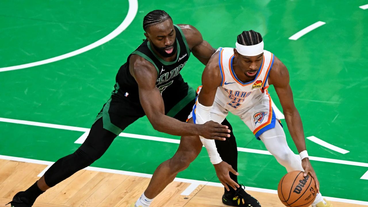 BOSTON, MASSACHUSETTS - MARCH 12: Jaylen Brown #7 of the Boston Celtics defends Shai Gilgeous-Alexander #2 of the Oklahoma City Thunder during the second quarter at the TD Garden on March 12, 2025 in Boston, Massachusetts. (Photo by Brian Fluharty/Getty Images)