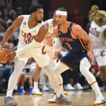 CLEVELAND, OHIO - APRIL 15: Donovan Mitchell #45 of the Cleveland Cavaliers posts up against Josh Hart #3 of the New York Knicks during the second quarter of Game One of the Eastern Conference First Round Playoffs at Rocket Mortgage Fieldhouse on April 15, 2023 in Cleveland, Ohio. (Photo by Jason Miller/Getty Images)