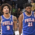 PHILADELPHIA, PA - DECEMBER 18: Kelly Oubre Jr. #9 and Joel Embiid #21 of the Philadelphia 76ers of the Philadelphia 76ers look on during the game against the Chicago Bulls on December 18, 2023 at the Wells Fargo Center in Philadelphia, Pennsylvania (Photo by David Dow/NBAE via Getty Images)