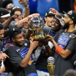 May 25, 2026; Cleveland, Ohio, USA; New York Knicks lift the 2026 Eastern Conference trophy after defeating the Cleveland Cavaliers in game four of the eastern conference finals for the 2026 NBA playoffs at Rocket Arena. Mandatory Credit: David Richard-Imagn Images