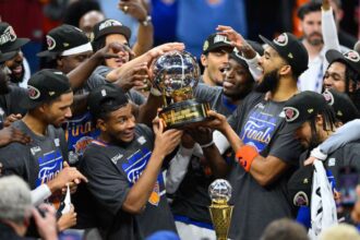May 25, 2026; Cleveland, Ohio, USA; New York Knicks lift the 2026 Eastern Conference trophy after defeating the Cleveland Cavaliers in game four of the eastern conference finals for the 2026 NBA playoffs at Rocket Arena. Mandatory Credit: David Richard-Imagn Images
