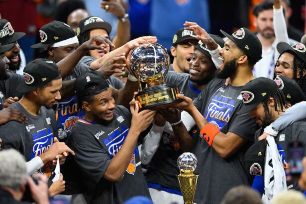 May 25, 2026; Cleveland, Ohio, USA; New York Knicks lift the 2026 Eastern Conference trophy after defeating the Cleveland Cavaliers in game four of the eastern conference finals for the 2026 NBA playoffs at Rocket Arena. Mandatory Credit: David Richard-Imagn Images