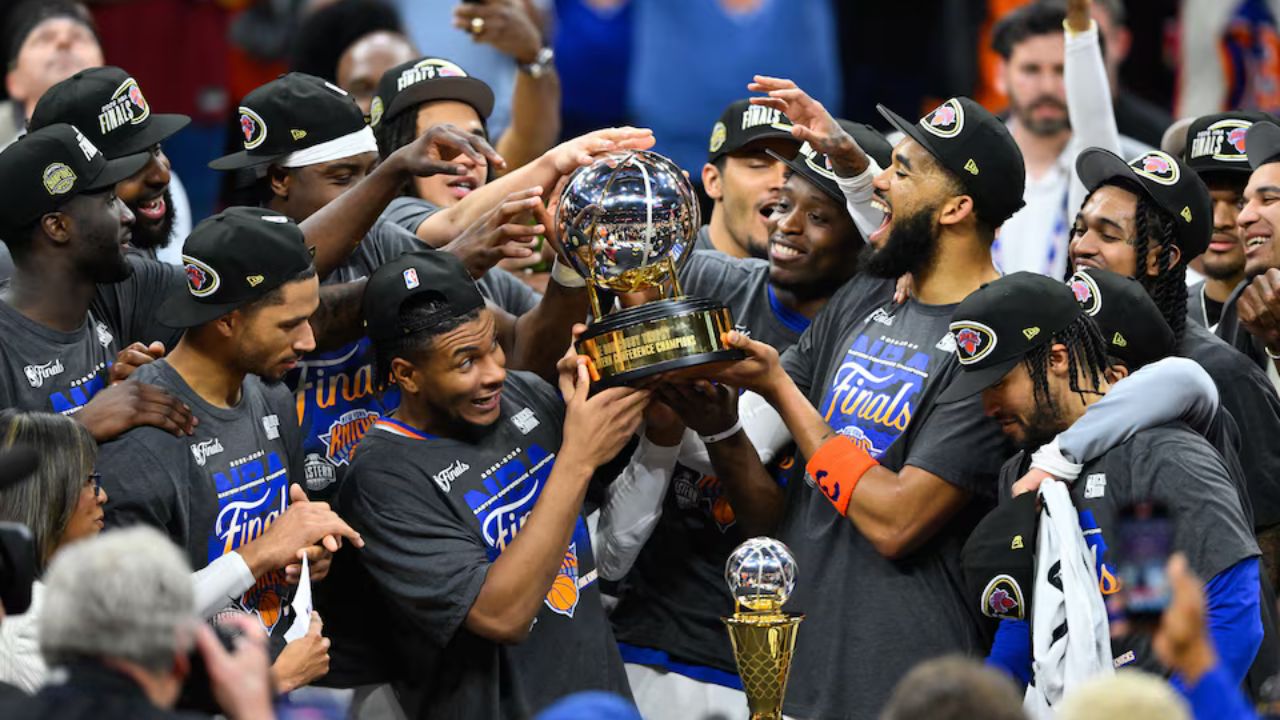 May 25, 2026; Cleveland, Ohio, USA; New York Knicks lift the 2026 Eastern Conference trophy after defeating the Cleveland Cavaliers in game four of the eastern conference finals for the 2026 NBA playoffs at Rocket Arena. Mandatory Credit: David Richard-Imagn Images