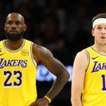 Feb 26, 2026; Phoenix, Arizona, USA; Los Angeles Lakers guard Austin Reaves (15) with forward LeBron James (23) against the Phoenix Suns at Mortgage Matchup Center. Mandatory Credit: Mark J. Rebilas-Imagn Images