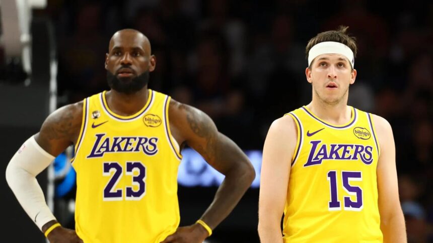 Feb 26, 2026; Phoenix, Arizona, USA; Los Angeles Lakers guard Austin Reaves (15) with forward LeBron James (23) against the Phoenix Suns at Mortgage Matchup Center. Mandatory Credit: Mark J. Rebilas-Imagn Images