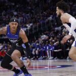 Apr 29, 2026; Detroit, Michigan, USA; Orlando Magic forward Paolo Banchero (5) dribbles defended by Detroit Pistons guard Cade Cunningham (2) in the first half during game five of the first round of the 2026 NBA Playoffs at Little Caesars Arena. Mandatory Credit: Rick Osentoski-Imagn Images