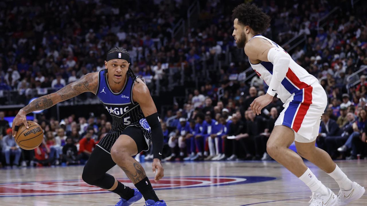 Apr 29, 2026; Detroit, Michigan, USA; Orlando Magic forward Paolo Banchero (5) dribbles defended by Detroit Pistons guard Cade Cunningham (2) in the first half during game five of the first round of the 2026 NBA Playoffs at Little Caesars Arena. Mandatory Credit: Rick Osentoski-Imagn Images
