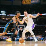 OKLAHOMA CITY, OKLAHOMA - APRIL 6: Shai Gilgeous-Alexander #2 of the Oklahoma City Thunder drives to the basket around Luka Doncic #77 of the Los Angeles Lakers during the second quarter at Paycom Center on April 6, 2025 in Oklahoma City, Oklahoma.(Photo by William Purnell/Getty Images)