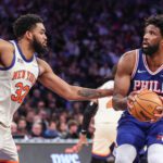 Philadelphia 76ers center Joel Embiid (21) looks to shoot past New York Knicks center Karl-Anthony Towns (32) in the third quarter at Madison Square Garden.