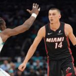 Apr 14, 2026; Charlotte, North Carolina, USA; Miami Heat guard Tyler Herro (14) handles the ball against Charlotte Hornets forward Moussa Diabaté (14) during the second quarter during the play-in rounds between the Charlotte Hornets and the Miami Heat of the 2026 NBA Playoffs at Spectrum Center. Mandatory Credit: Jim Dedmon-Imagn Images
