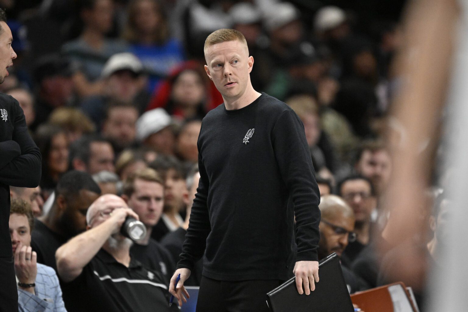San Antonio Spurs associate coach Sean Sweeney looks on during the second half against the Dallas Mavericks at the American Airlines Center.