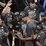 San Antonio Spurs forward Victor Wembanyama (1) celebrates with the MVP trophy after defeating the Oklahoma City Thunder in game seven of the western conference finals for the 2026 NBA playoffs at Paycom Center.