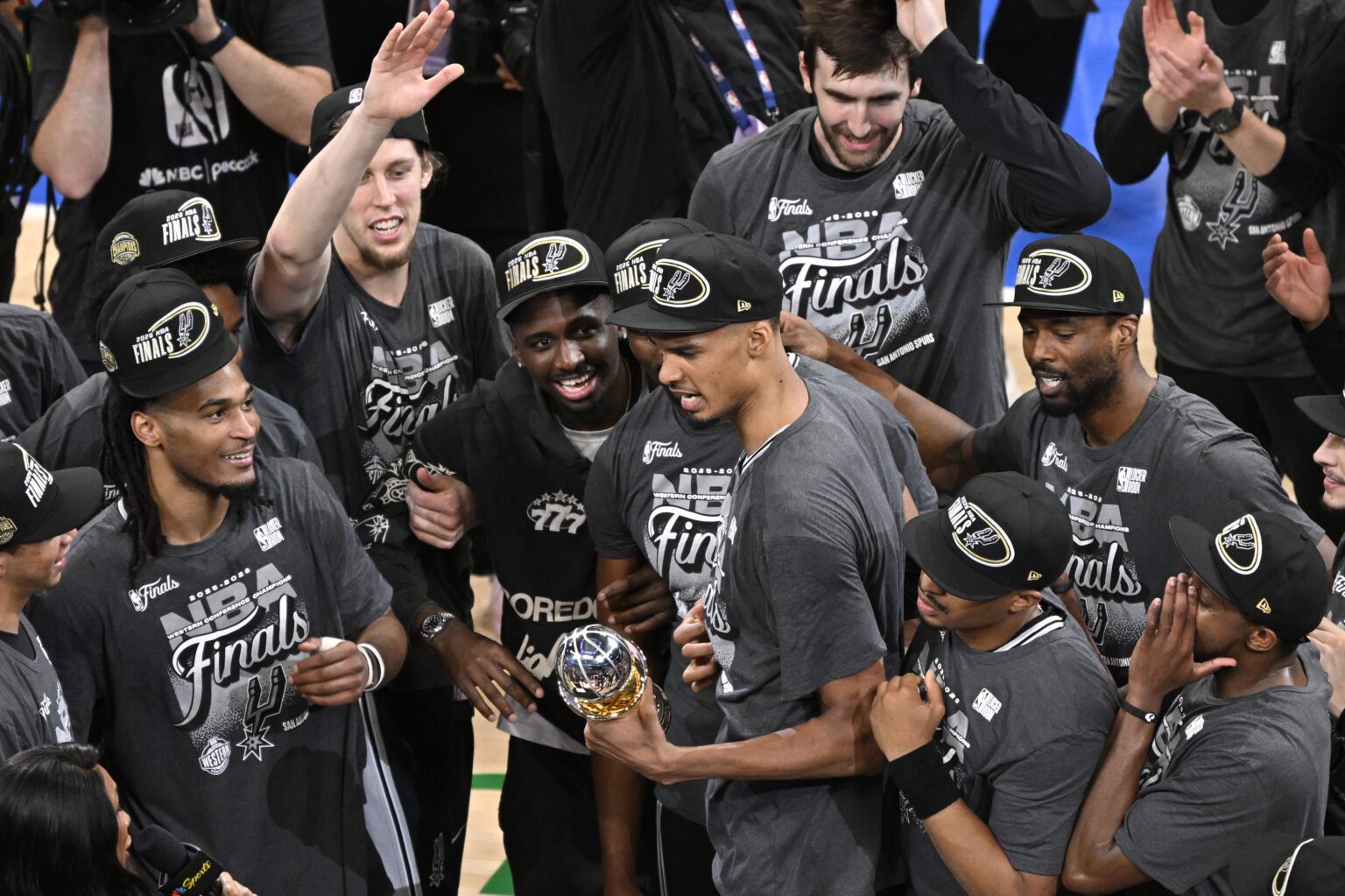 San Antonio Spurs forward Victor Wembanyama (1) celebrates with the MVP trophy after defeating the Oklahoma City Thunder in game seven of the western conference finals for the 2026 NBA playoffs at Paycom Center.