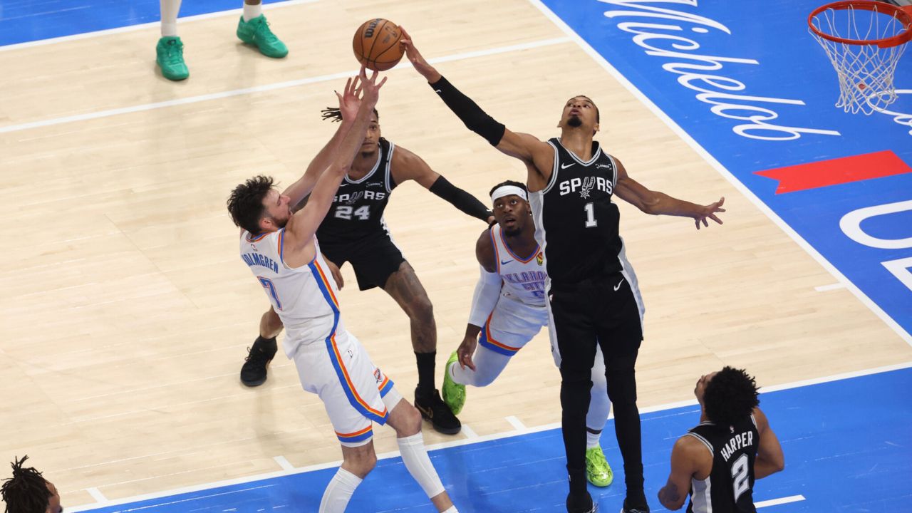 May 26, 2026; Oklahoma City, Oklahoma, USA; San Antonio Spurs forward Victor Wembanyama (1) blocksOklahoma City Thunder center Chet Holmgren (7) during the second quarter in game five of the western conference finals for the 2026 NBA playoffs at Paycom Center. Mandatory Credit: Brett Rojo-Imagn Images