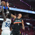 May 4, 2026; San Antonio, Texas, USA; Minnesota Timberwolves forward Julius Randle (30) shoots against San Antonio Spurs forward Victor Wembanyama (1) in the first half during game one of the second round of the 2026 NBA Playoffs at Frost Bank Center. Mandatory Credit: Daniel Dunn-Imagn Images