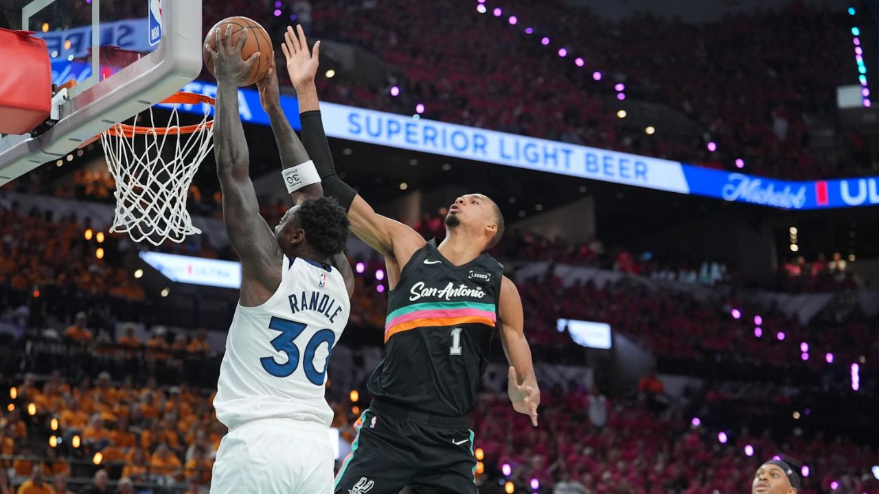 May 4, 2026; San Antonio, Texas, USA; Minnesota Timberwolves forward Julius Randle (30) shoots against San Antonio Spurs forward Victor Wembanyama (1) in the first half during game one of the second round of the 2026 NBA Playoffs at Frost Bank Center. Mandatory Credit: Daniel Dunn-Imagn Images