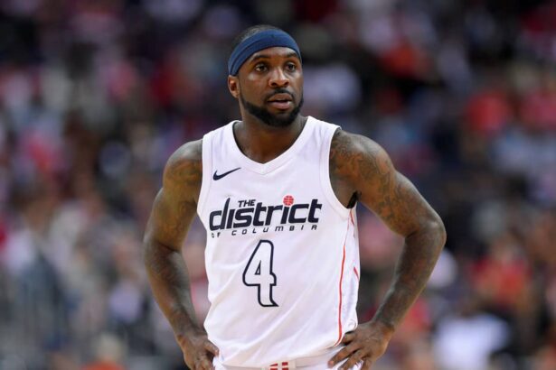 Washington Wizards guard Ty Lawson (4) looks on during the second half of Game 4 of an NBA basketball first-round playoff series against the Toronto Raptors, in Washington. Less than three weeks ago, Lawson was playing professional basketball in China. Nowadays, he's been one of the first subs off the bench for the Washington Wizards in their Eastern Conference first-round playoff series against the No. 1 seed Toronto Raptors (AP Photo/Nick Wass, File)