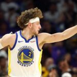 Apr 17, 2026; Phoenix, Arizona, USA; Golden State Warriors guard Brandin Podziemski (2) reacts against the Phoenix Suns during the first half in the play-in rounds of the 2026 NBA Playoffs at Mortgage Matchup Center. Mandatory Credit: Mark J. Rebilas-Imagn Images