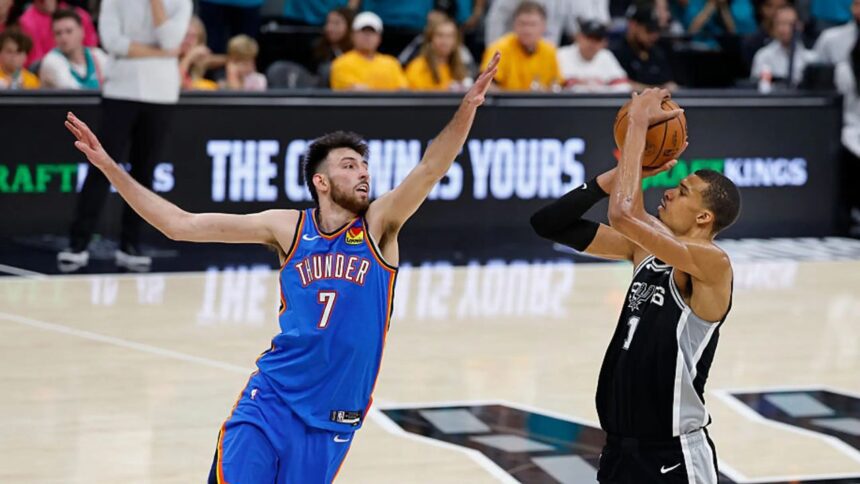 SAN ANTONIO, TX - MAY 22: Victor Wembanyama #1 of the San Antonio Spurs shoots over Chet Holmgren #7 of the Oklahoma City Thunder in the fourth quarter of Game Three of the Western Conference Finals NBA Playoffs at Frost Bank Center on May 22, 2026 in San Antonio, Texas. (Photo by Ronald Cortes/Getty Images)