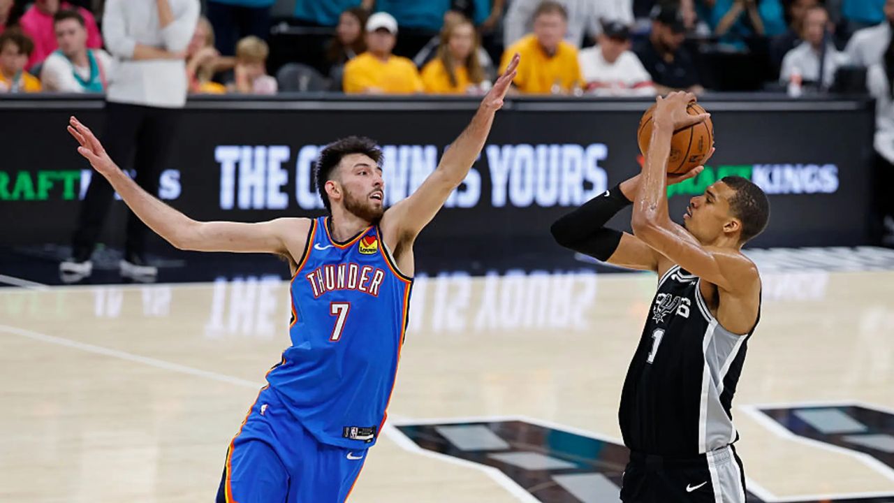 SAN ANTONIO, TX - MAY 22: Victor Wembanyama #1 of the San Antonio Spurs shoots over Chet Holmgren #7 of the Oklahoma City Thunder in the fourth quarter of Game Three of the Western Conference Finals NBA Playoffs at Frost Bank Center on May 22, 2026 in San Antonio, Texas. (Photo by Ronald Cortes/Getty Images)