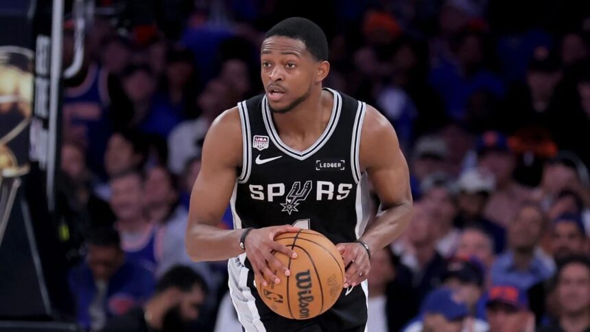 Jun 10, 2026; New York, New York, USA; San Antonio Spurs guard De'aaron Fox (4) controls the ball against the New York Knicks during the fourth quarter of game four of the 2026 NBA Finals at Madison Square Garden. Mandatory Credit: Brad Penner-Imagn Images
