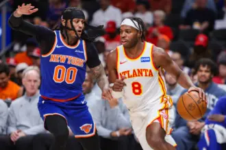 Apr 30, 2026; Atlanta, Georgia, USA; New York Knicks guard Jordan Clarkson (00) defends Atlanta Hawks guard Buddy Hield (8) in the third quarter during game six of the first round of the 2026 NBA Playoffs at State Farm Arena. Mandatory Credit: Brett Davis-Imagn Images