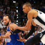 SAN ANTONIO, TEXAS - JUNE 13: Jalen Brunson #11 of the New York Knicks drives to the basket against Victor Wembanyama #1 of the San Antonio Spurs during the fourth quarter in Game Five of the 2026 NBA Finals at Frost Bank Center on June 13, 2026 in San Antonio, Texas. (Photo by Gregory Shamus/Getty Images)