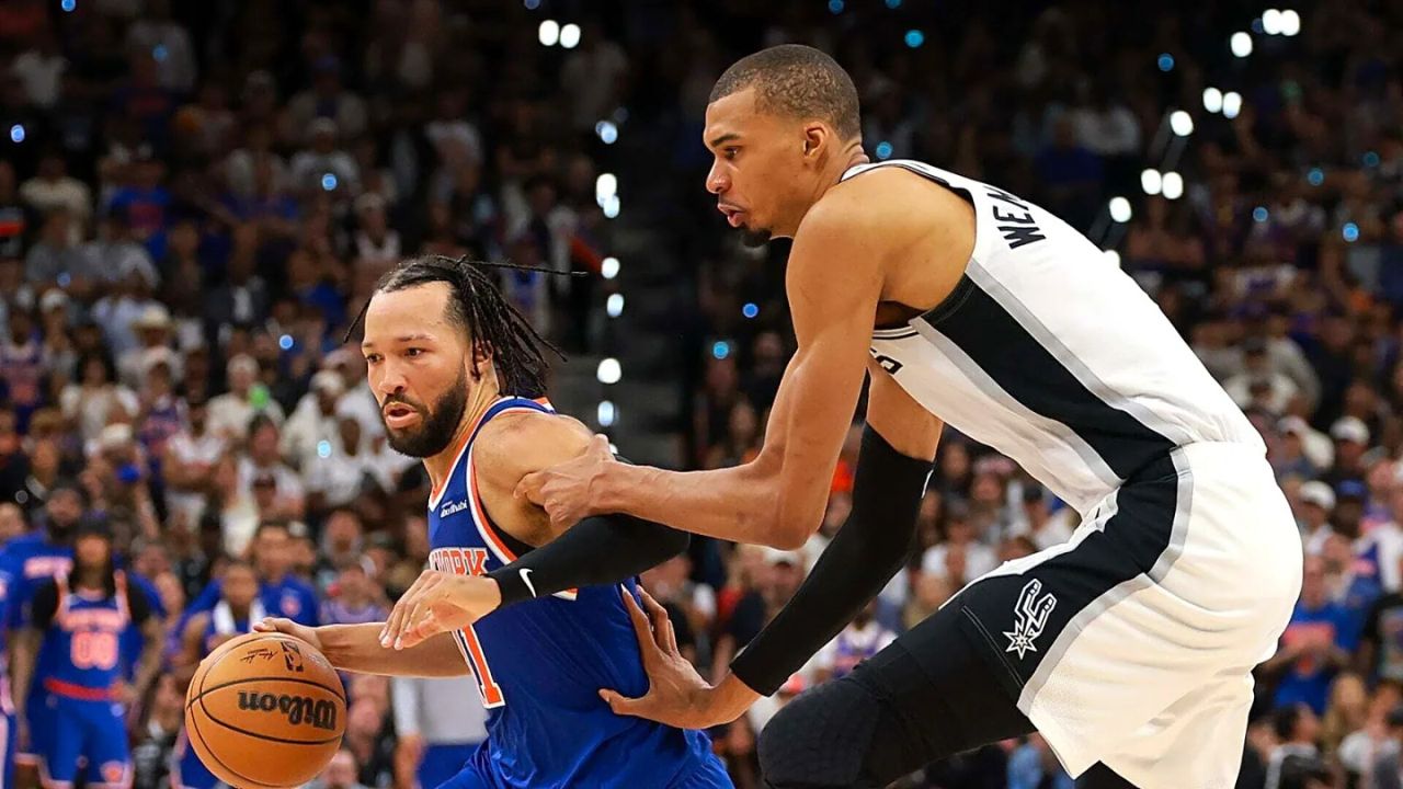 SAN ANTONIO, TEXAS - JUNE 13: Jalen Brunson #11 of the New York Knicks drives to the basket against Victor Wembanyama #1 of the San Antonio Spurs during the fourth quarter in Game Five of the 2026 NBA Finals at Frost Bank Center on June 13, 2026 in San Antonio, Texas. (Photo by Gregory Shamus/Getty Images)