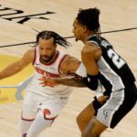 Jun 3, 2026; San Antonio, Texas, USA; New York Knicks guard Jalen Brunson (11) dribbles the ball against San Antonio Spurs guard Devin Vassell (24) in the first half during game one of the 2026 NBA Finals at Frost Bank Center. Mandatory Credit: Geoff Burke-Imagn Images