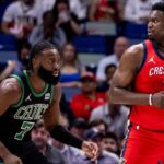 Mar 30, 2024; New Orleans, Louisiana, USA; New Orleans Pelicans forward Zion Williamson (1) looks to pass the ball against Boston Celtics guard Jaylen Brown (7) during the first half at Smoothie King Center. Mandatory Credit: Stephen Lew-Imagn Images