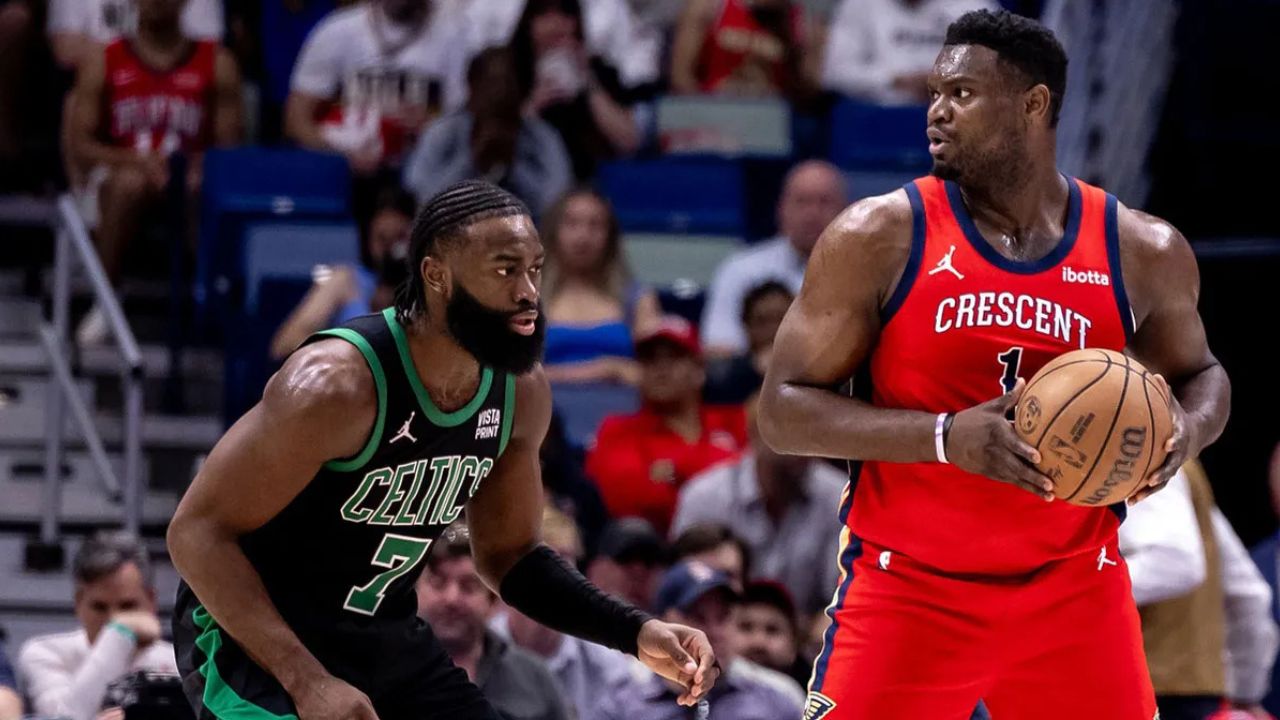 Mar 30, 2024; New Orleans, Louisiana, USA; New Orleans Pelicans forward Zion Williamson (1) looks to pass the ball against Boston Celtics guard Jaylen Brown (7) during the first half at Smoothie King Center. Mandatory Credit: Stephen Lew-Imagn Images