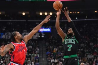 Boston Celtics guard Jaylen Brown shoots over Clippers forward Kawhi Leonard during the first half of the Clippers’ 146-115 loss Saturday night at Intuit Dome. (Mark J. Terrill / Associated Press)