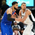 Jun 5, 2026; San Antonio, Texas, USA; New York Knicks center Karl-Anthony Towns (32) and San Antonio Spurs forward Victor Wembanyama (1) look for the ball in the second half during game two of the 2026 NBA Finals at Frost Bank Center. Mandatory Credit: Scott Wachter-Imagn Images