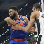 Jun 5, 2026; San Antonio, Texas, USA; New York Knicks center Karl-Anthony Towns (32) and San Antonio Spurs forward Victor Wembanyama (1) battle for position in the fourth quarter during Game 2 of the 2026 NBA Finals at Frost Bank Center. | Scott Wachter-Imagn Images
