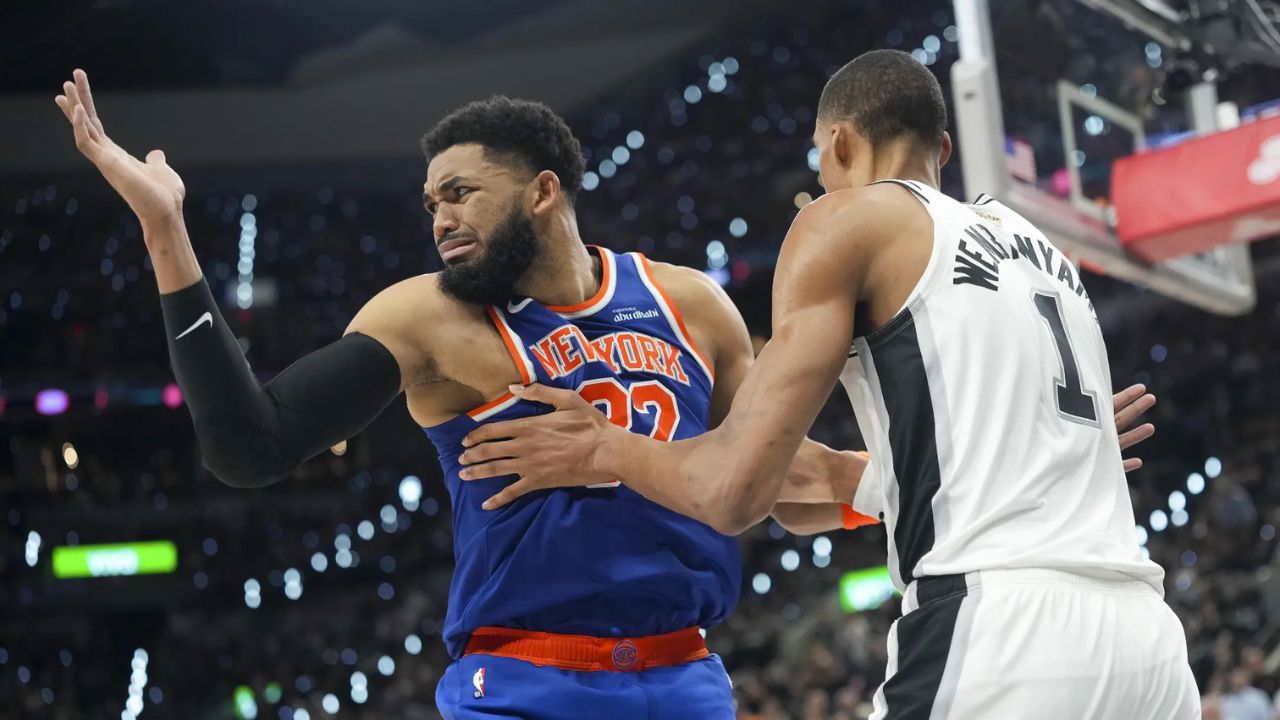 Jun 5, 2026; San Antonio, Texas, USA; New York Knicks center Karl-Anthony Towns (32) and San Antonio Spurs forward Victor Wembanyama (1) battle for position in the fourth quarter during Game 2 of the 2026 NBA Finals at Frost Bank Center. | Scott Wachter-Imagn Images