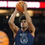 Apr 3, 2026; Indianapolis, IN, USA; Arizona Wildcats forward Koa Peat (10) holds a ball during a practice session ahead of the Final Four of the men's 2026 NCAA Tournament at Lucas Oil Stadium. Mandatory Credit: Robert Deutsch-Imagn Images