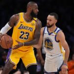LeBron James #23 of the Los Angeles Lakers controls the ball against Stephen Curry #30 of the Golden State Warriors. (Photo by Michael Owens/Getty Images)