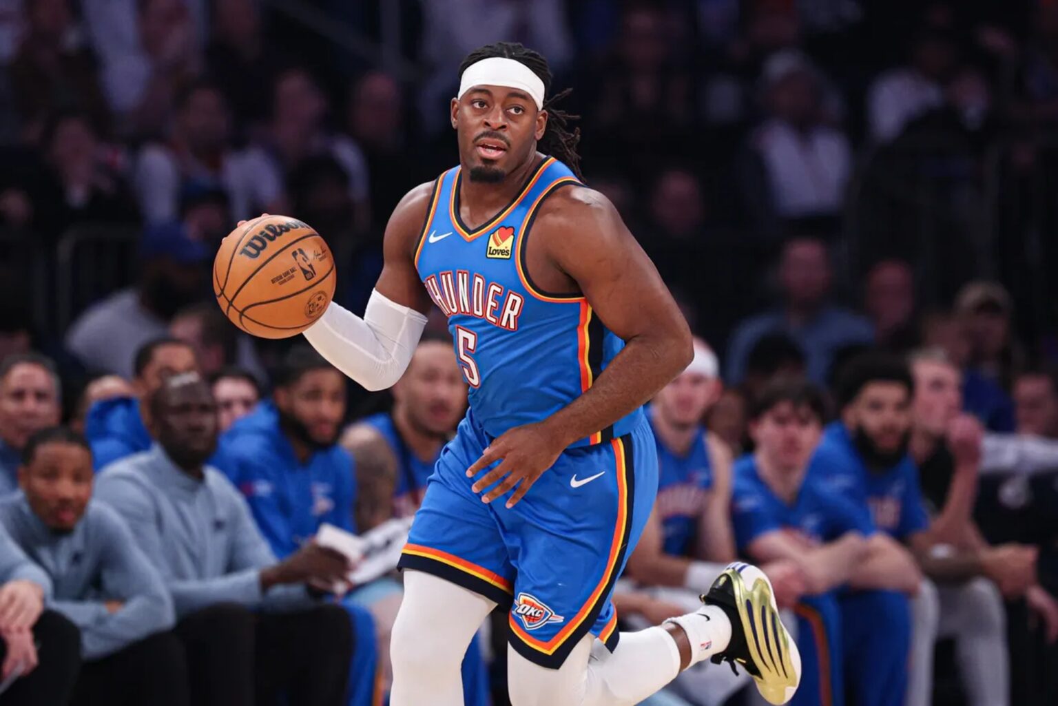 Mar 4, 2026; New York, New York, USA; Oklahoma City Thunder guard Luguentz Dort (5) dribbles up court against the New York Knicks during the first half at Madison Square Garden. Mandatory Credit: Vincent Carchietta-Imagn Images