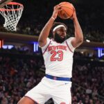 Apr 9, 2026; New York, New York, USA; New York Knicks center Mitchell Robinson (23) secures a rebound during the fourth quarter against the Boston Celtics at Madison Square Garden. Mandatory Credit: Lucas Boland-Imagn Images