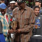 CLEVELAND, OH - MAY 25: Walt Frazier & Patrick Ewing hand Jalen Brunson #11 of the New York Knicks the Larry Bird Trophy after being named the NBA's Eastern Conference Finals Most Valuable Player after Game Four of the 2026 NBA Eastern Conference Finals on May 25, 2026 at Rocket Arena in Cleveland, Ohio. NOTE TO USER: User expressly acknowledges and agrees that, by downloading and/or using this Photograph, user is consenting to the terms and conditions of the Getty Images License Agreement. Mandatory Copyright Notice: Copyright 2026 NBAE (Photo by David Liam Kyle/NBAE via Getty Images)