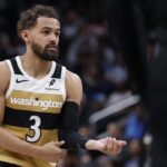 Mar 5, 2026; Washington, District of Columbia, USA; Washington Wizards guard Trae Young (3) stands on the court against the Utah Jazz in the second half at Capital One Arena. Mandatory Credit: Geoff Burke-Imagn Images