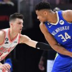 Feb 4, 2023; Milwaukee, Wisconsin, USA; Milwaukee Bucks forward Giannis Antetokounmpo (34) controls the ball against Miami Heat guard Tyler Herro (14) in the second half at Fiserv Forum. Mandatory Credit: Michael McLoone-Imagn Images