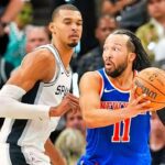 Jun 5, 2026; San Antonio, Texas, USA; New York Knicks guard Jalen Brunson (11) looks to move the ball past San Antonio Spurs forward Victor Wembanyama (1) in the second half during game two of the 2026 NBA Finals at Frost Bank Center. Mandatory Credit: Scott Wachter-Imagn Images