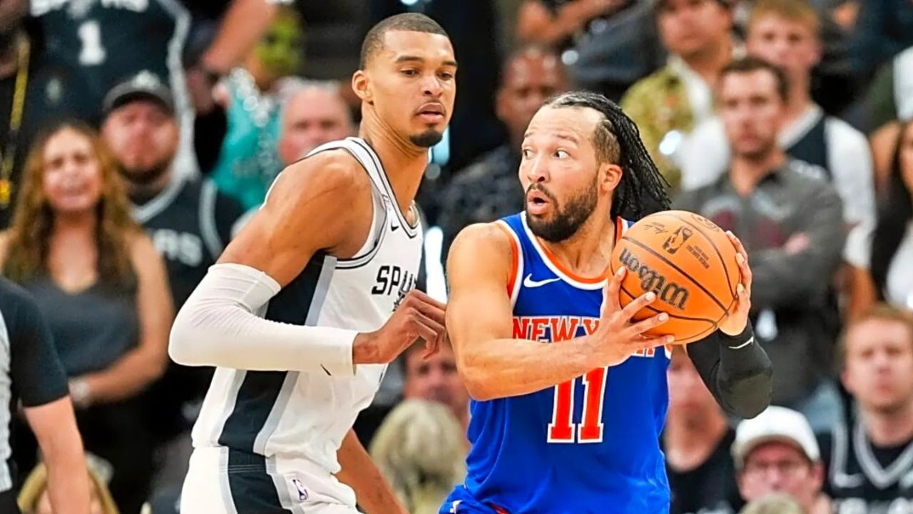 Jun 5, 2026; San Antonio, Texas, USA; New York Knicks guard Jalen Brunson (11) looks to move the ball past San Antonio Spurs forward Victor Wembanyama (1) in the second half during game two of the 2026 NBA Finals at Frost Bank Center. Mandatory Credit: Scott Wachter-Imagn Images