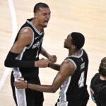 May 30, 2026; Oklahoma City, Oklahoma, USA; San Antonio Spurs forward Victor Wembanyama (1) celebrates with guard De'aaron Fox (4) after defeating the Oklahoma City Thunder in game seven of the western conference finals for the 2026 NBA playoffs at Paycom Center. Mandatory Credit: Jerome Miron-Imagn Images