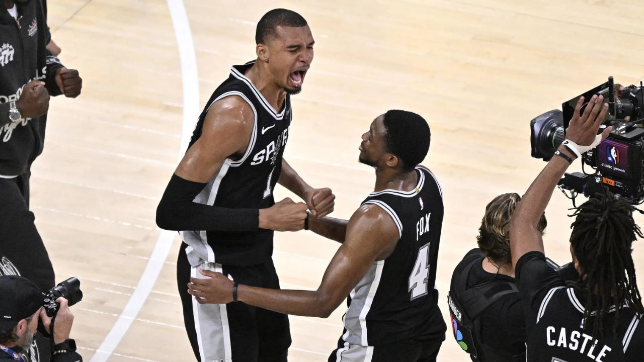May 30, 2026; Oklahoma City, Oklahoma, USA; San Antonio Spurs forward Victor Wembanyama (1) celebrates with guard De'aaron Fox (4) after defeating the Oklahoma City Thunder in game seven of the western conference finals for the 2026 NBA playoffs at Paycom Center. Mandatory Credit: Jerome Miron-Imagn Images