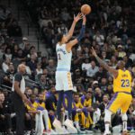 Nov 27, 2024; San Antonio, Texas, USA; San Antonio Spurs center Victor Wembanyama (1) shoots over Los Angeles Lakers forward LeBron James (23) in the second half at Frost Bank Center. Mandatory Credit: Daniel Dunn-Imagn Images