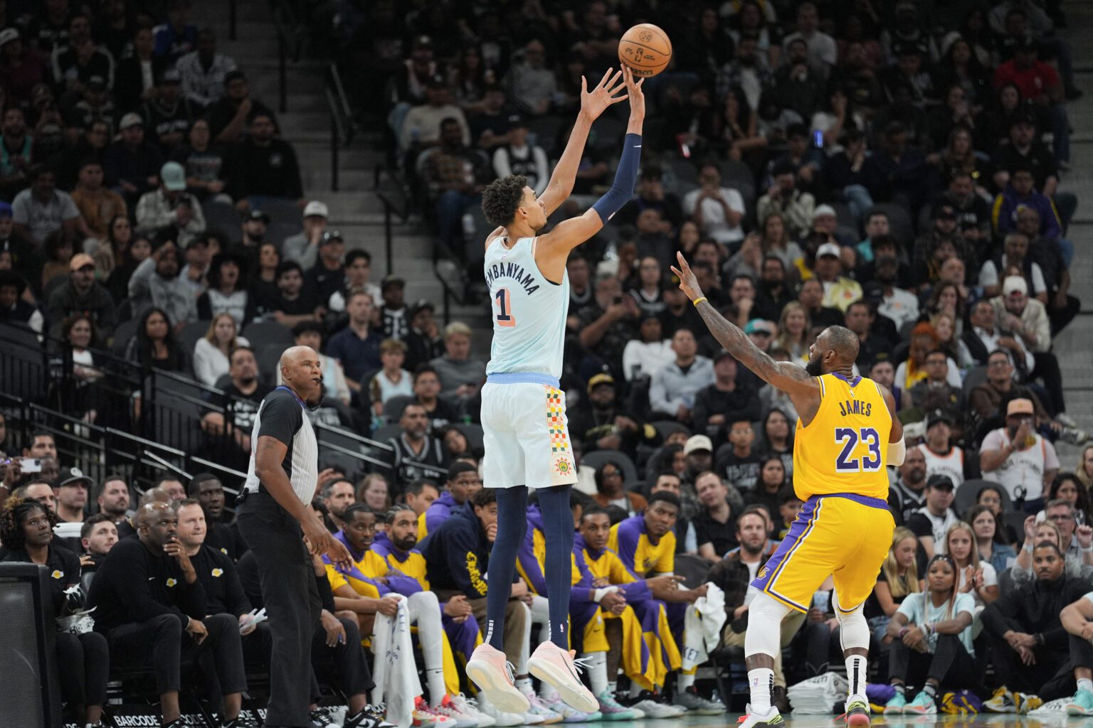 Nov 27, 2024; San Antonio, Texas, USA; San Antonio Spurs center Victor Wembanyama (1) shoots over Los Angeles Lakers forward LeBron James (23) in the second half at Frost Bank Center. Mandatory Credit: Daniel Dunn-Imagn Images