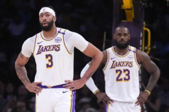 Dec 15, 2024; Los Angeles, California, USA; Los Angeles Lakers forward Anthony Davis (3) and forward LeBron James (23) react in the first half against the Memphis Grizzlies at Crypto.com Arena. Mandatory Credit: Kirby Lee-Imagn Images